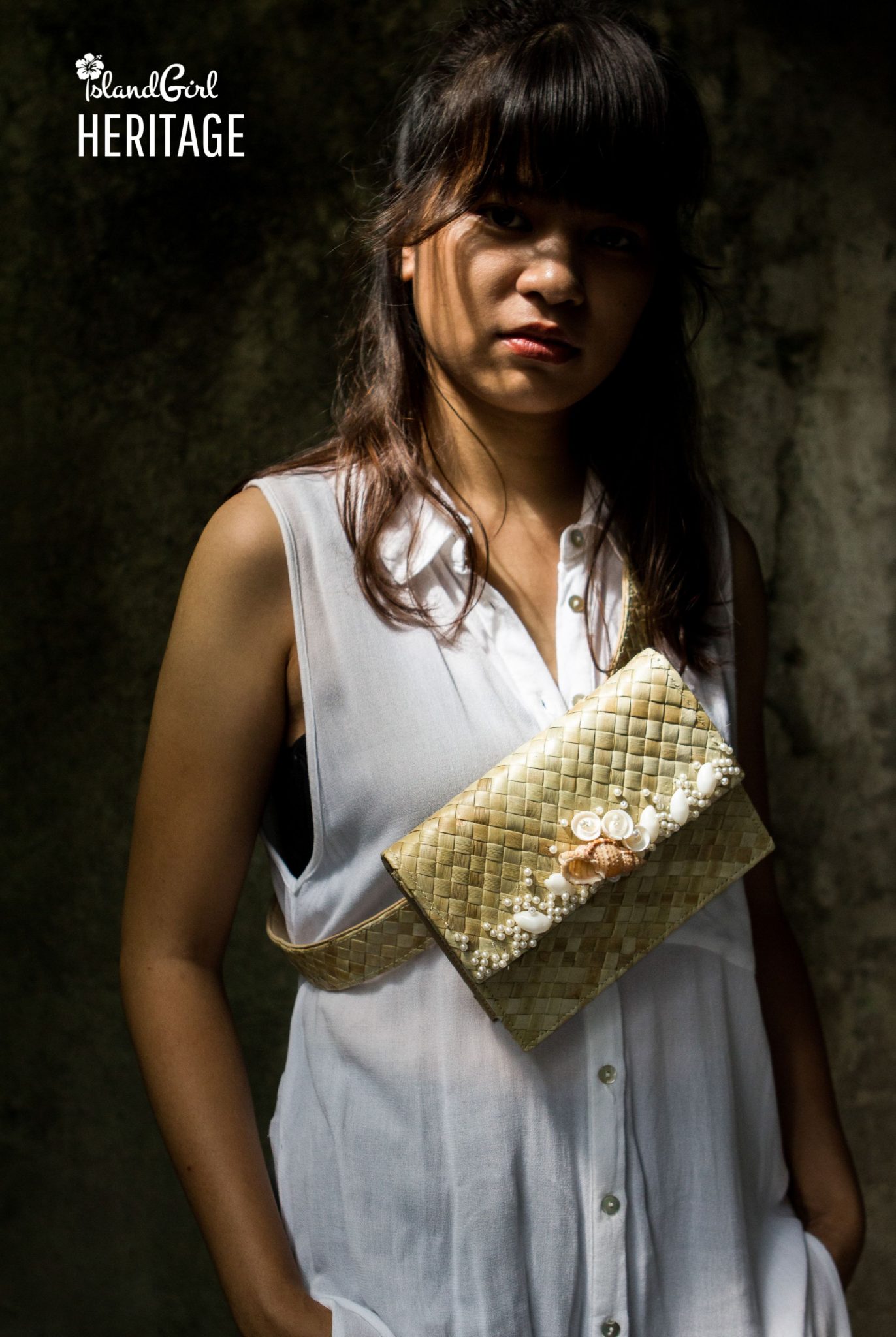 Image of a woman wearing a belt bag in white sleeveless shirt